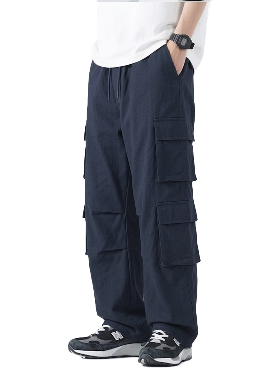 Navy cargo pants worn by a person on a white background